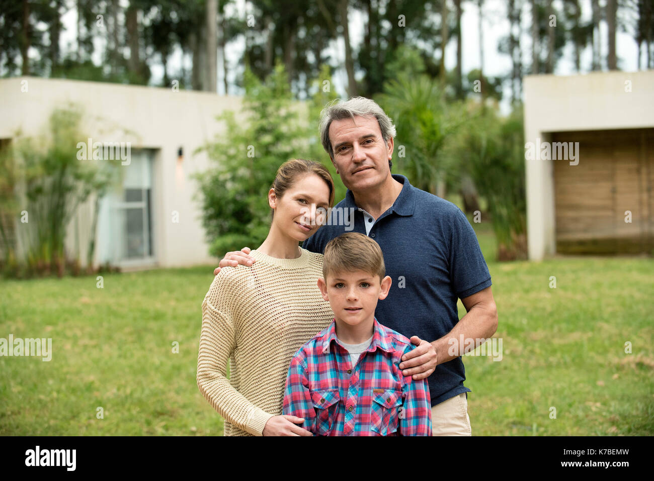 Family standing together outdoors, portrait Stock Photo Alamy