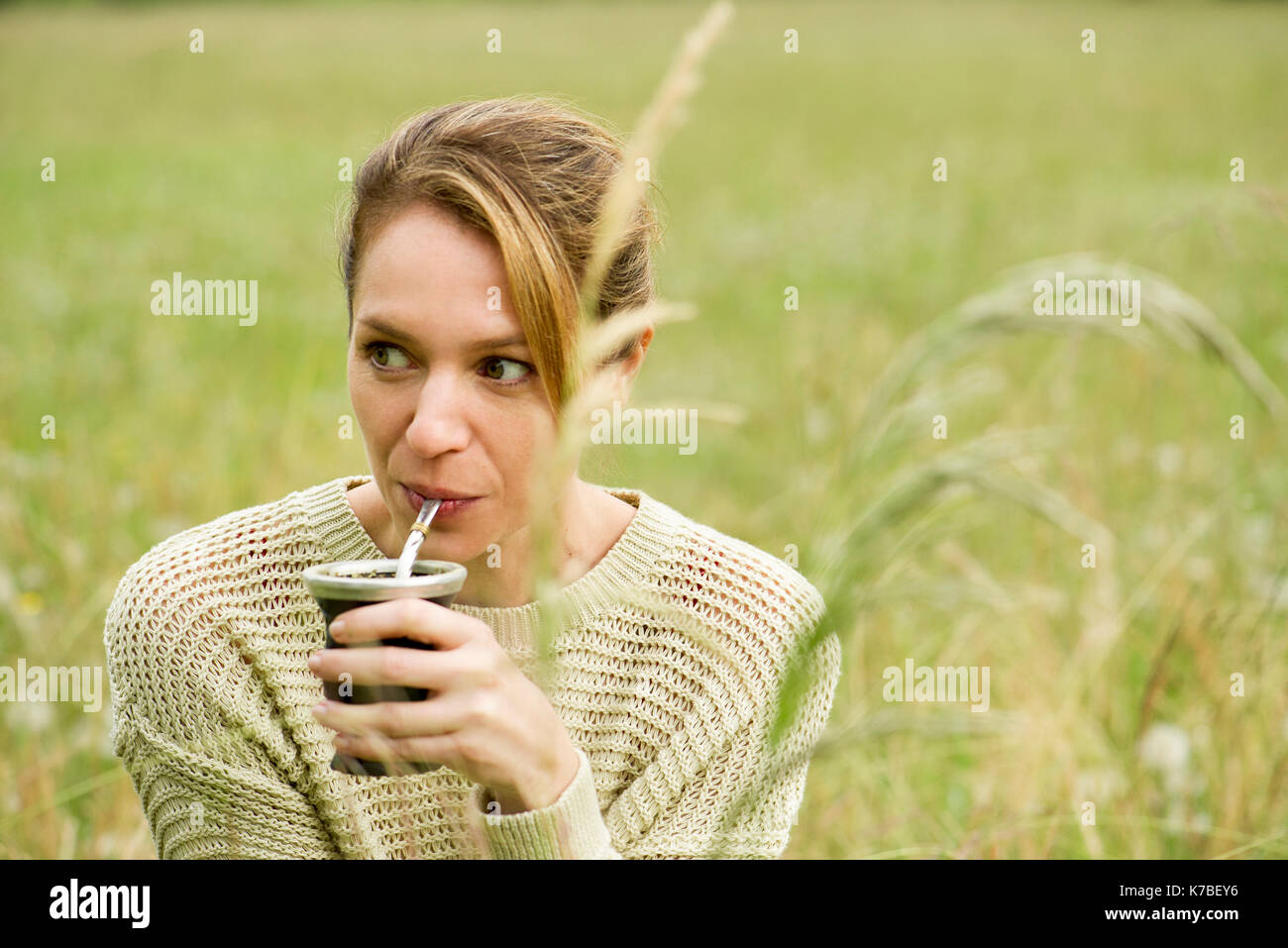 Woman drinking yerba mate, portrait Stock Photo