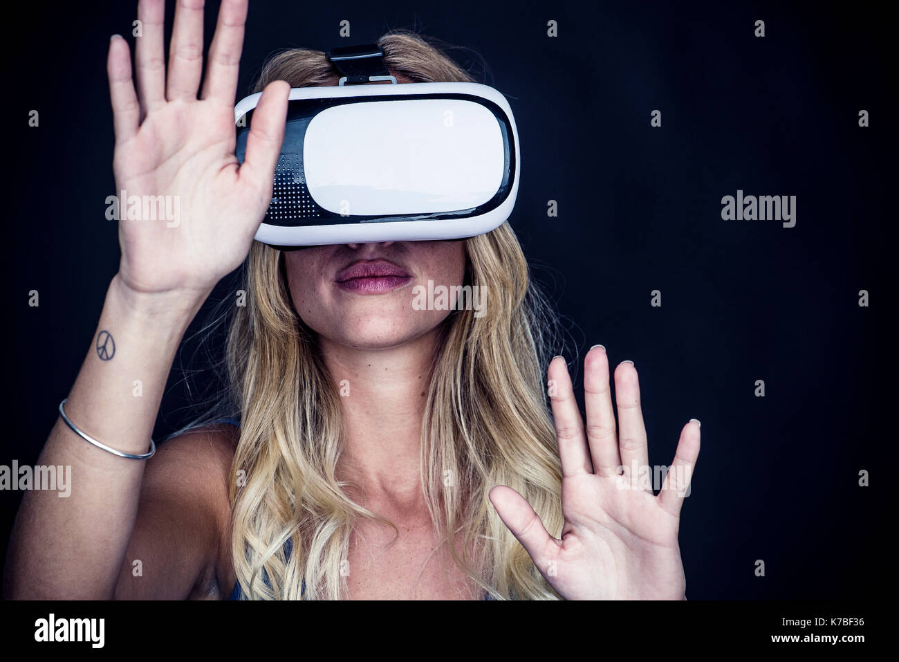 Woman using virtual reality simulator Stock Photo