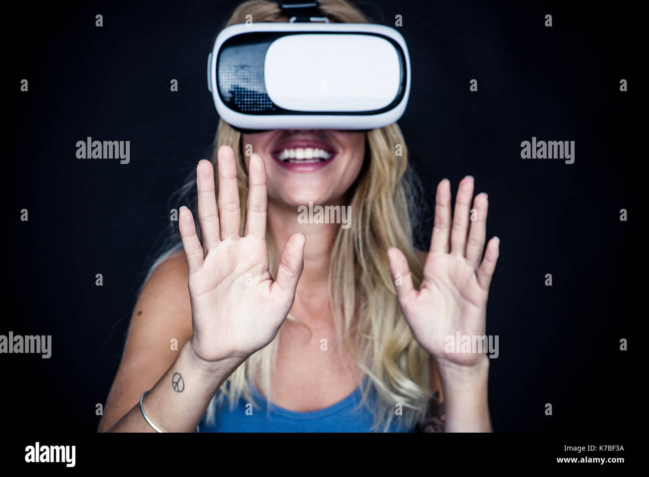 Blonde woman wearing virtual hi-res stock photography and images - Alamy