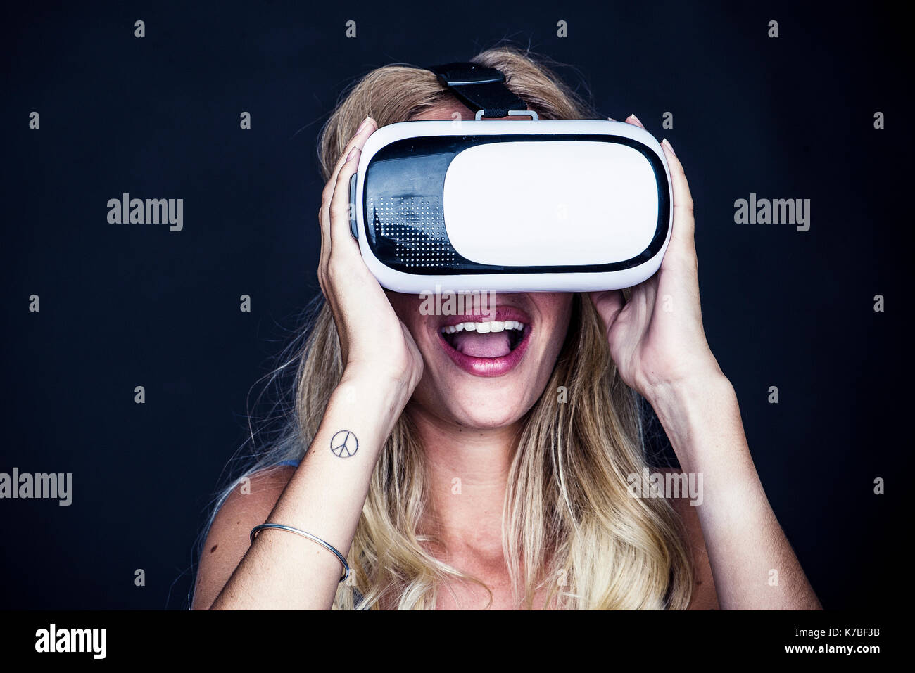 Blonde woman wearing virtual hi-res stock photography and images - Alamy