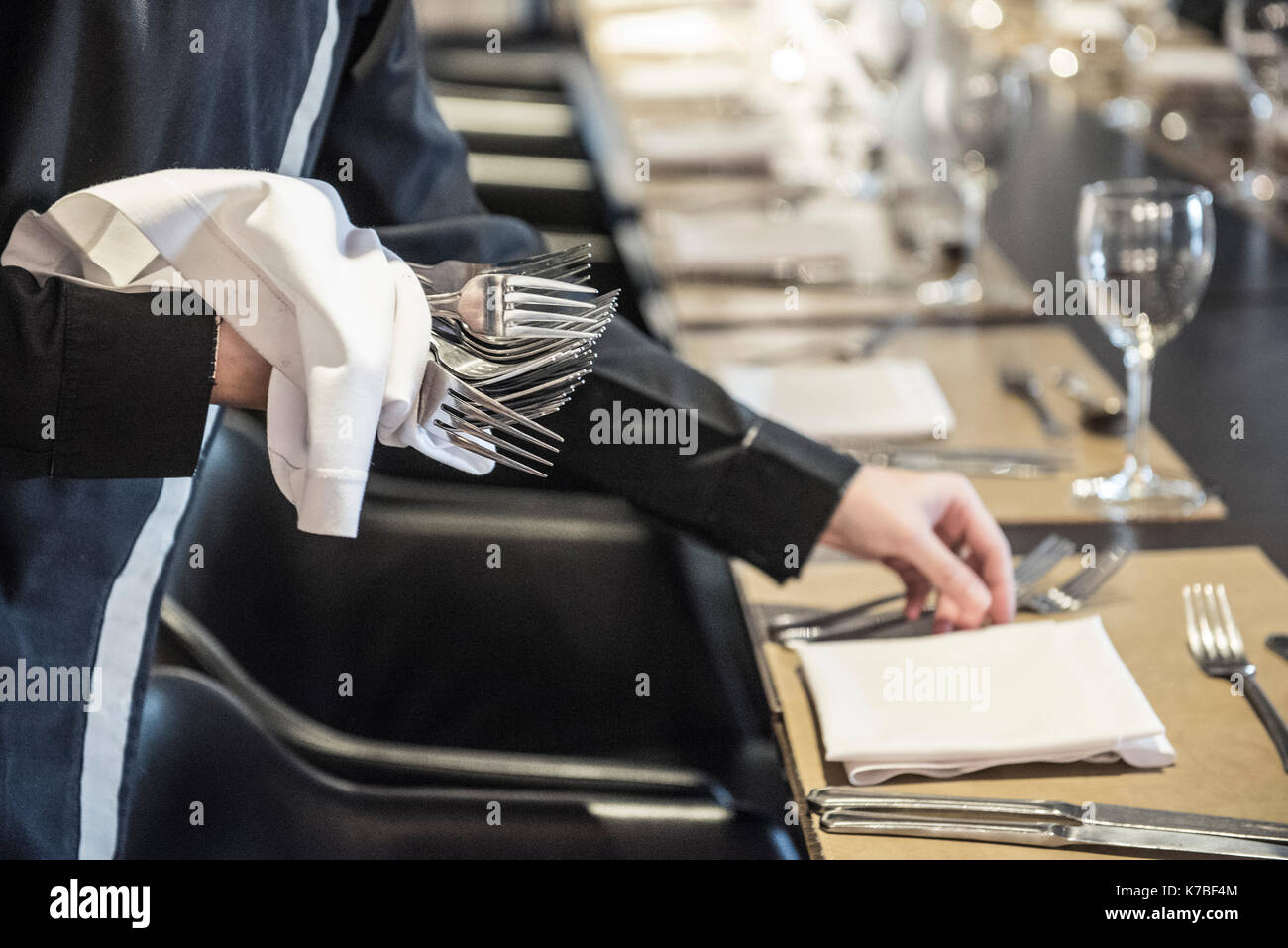 Waiter setting table Stock Photo Alamy