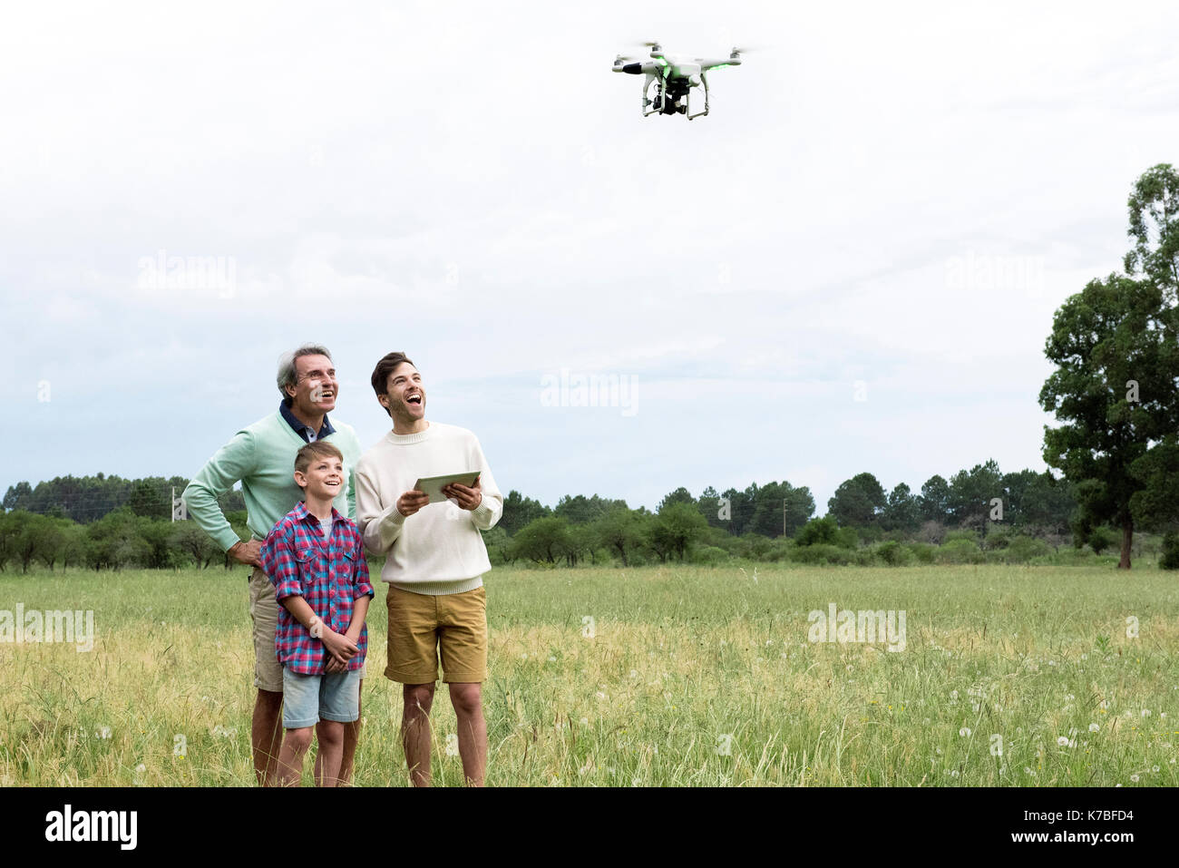 Multi-generation family playing with drone Stock Photo - Alamy