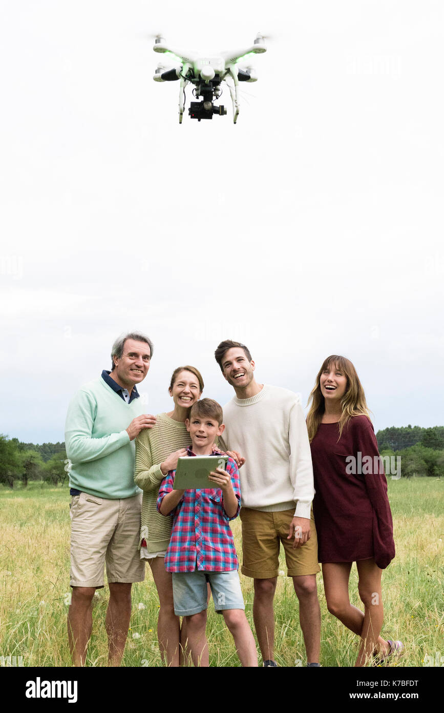 Family playing with drone together Stock Photo