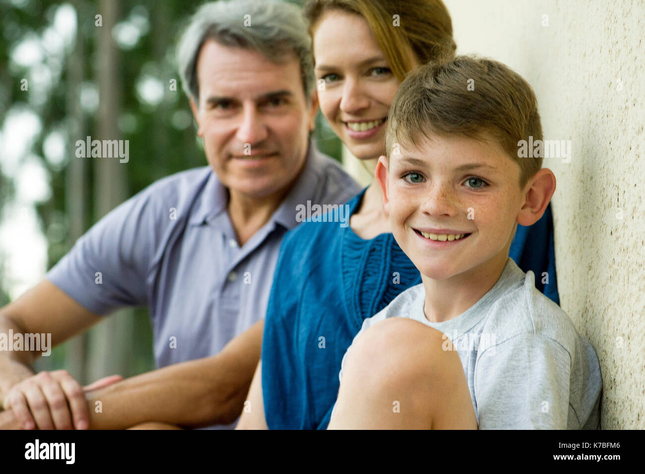 Boy with parents, portrait Stock Photo