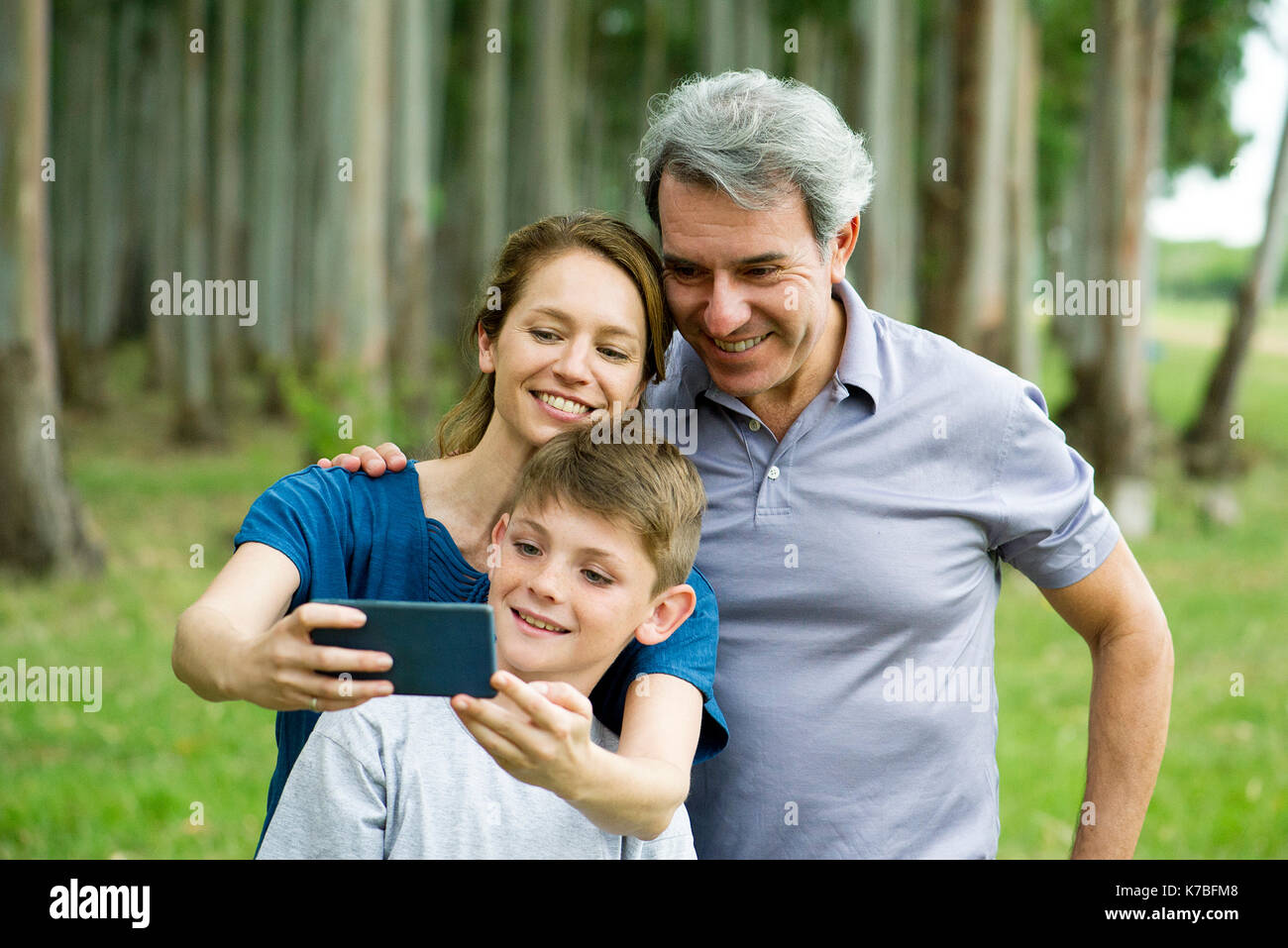 Family posing for selfie Stock Photo