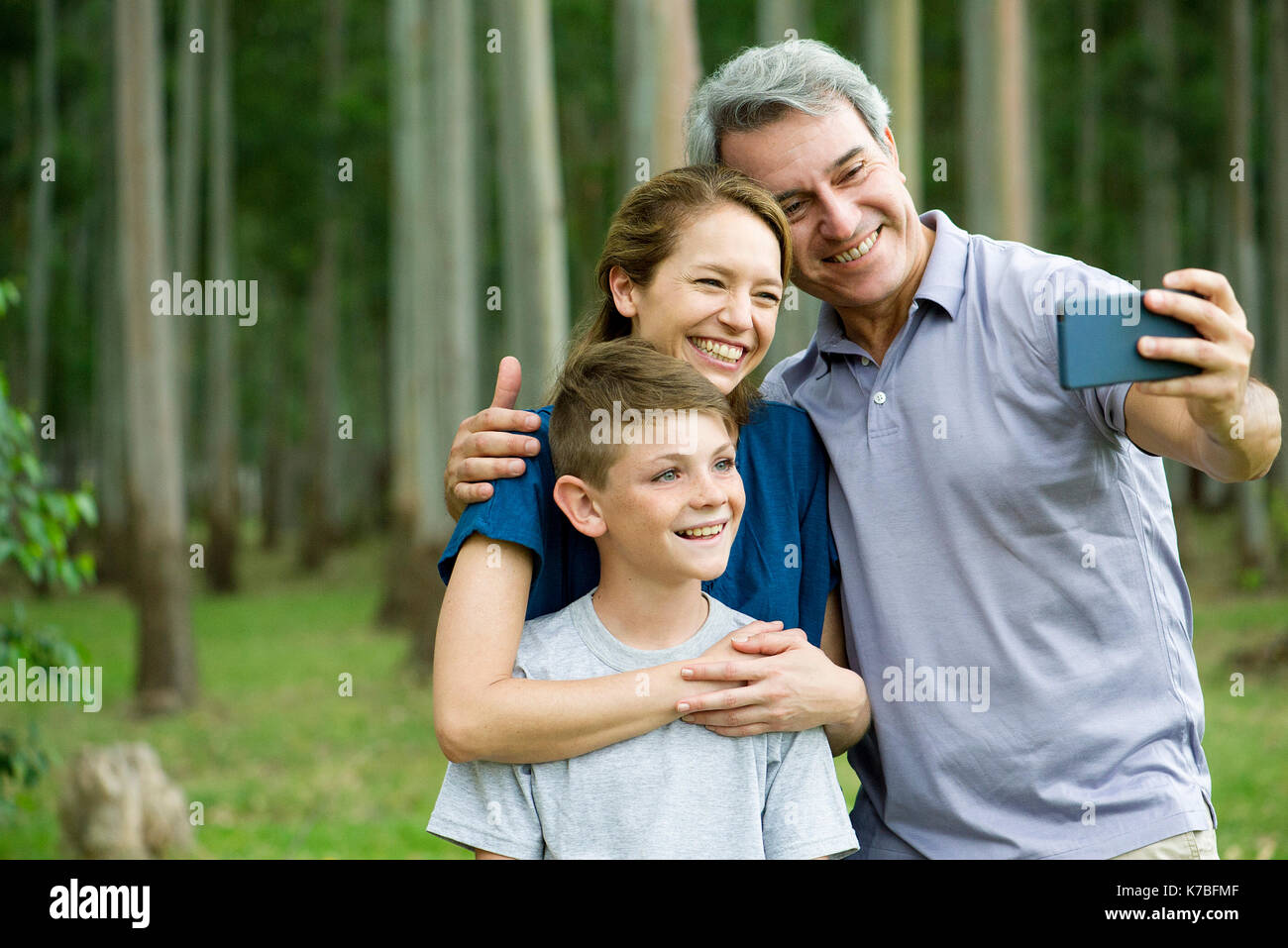 Family posing for selfie Stock Photo