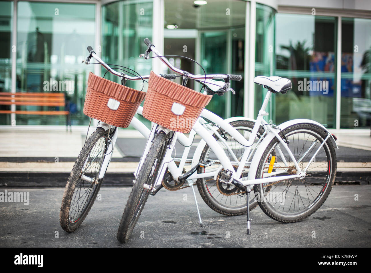 Pair of bicycles parked in front of building Stock Photo