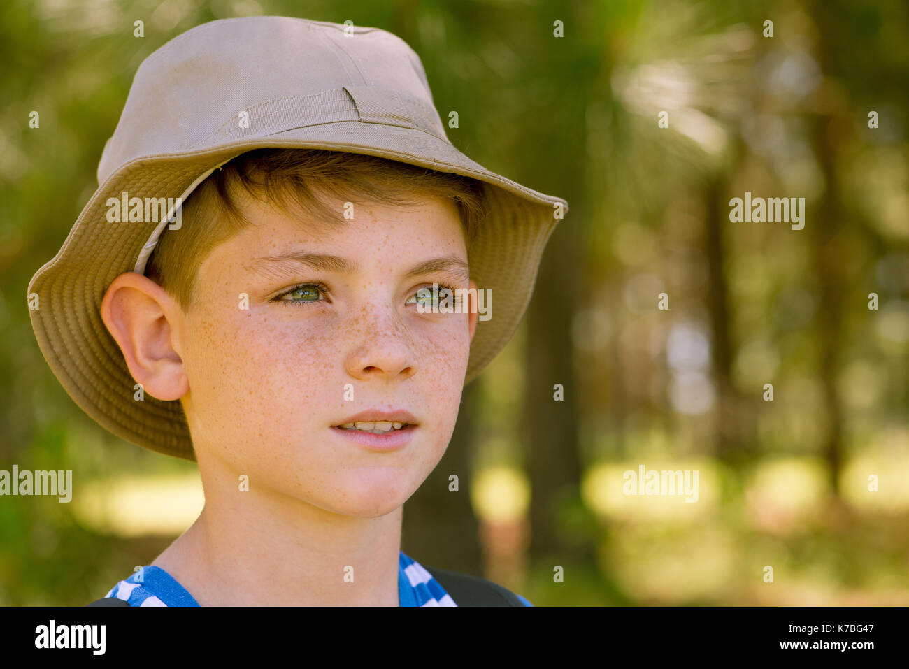 Preteen boy looking into distance Stock Photo