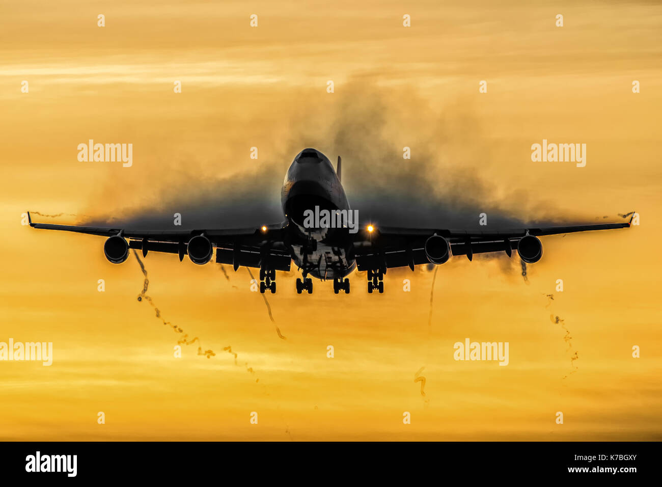 Boeing 747-400 on a sunrise approuch with condensation over the wings from  a cold winters day Stock Photo