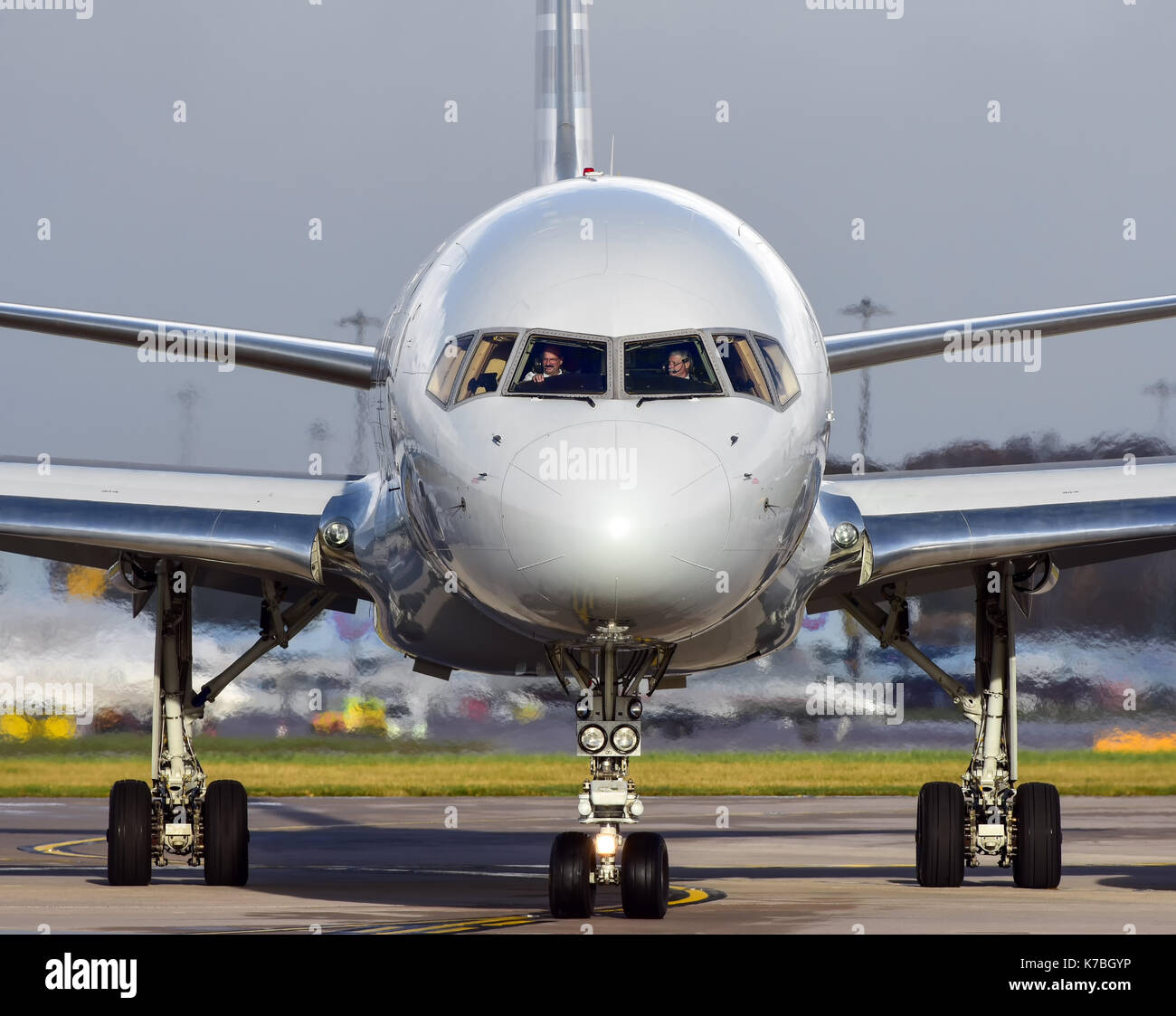 A close up Nose of the Boeing 757 with Pilots at the controls at Manchester Airport UK Stock Photo