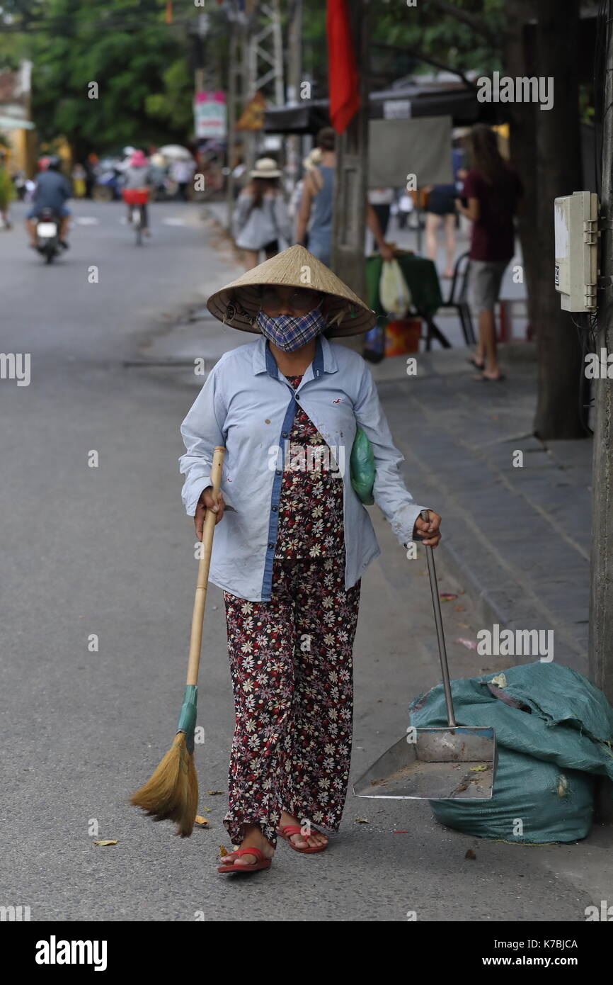 A single local Vietnamese in the streets of Hoi An old town, Vietnam Stock Photo