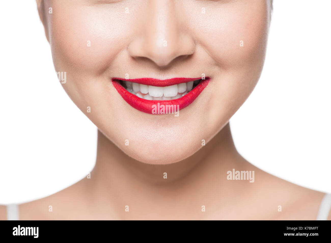 Beautiful asian face with red lips over white. Stock Photo