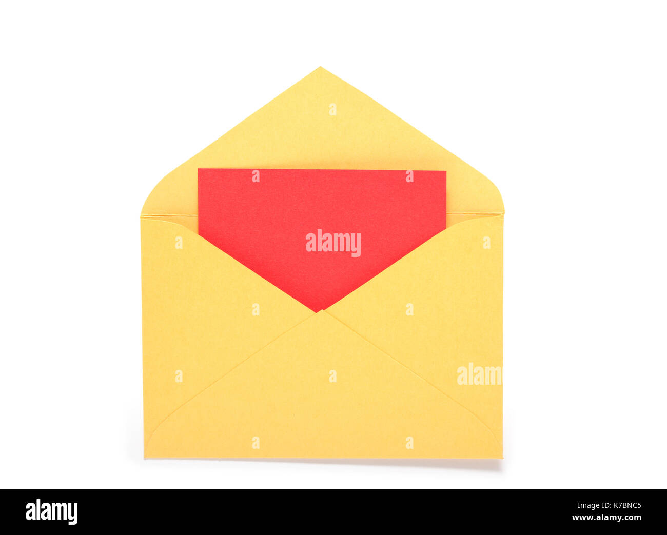 Red blank paper inside yellow envelope. Isolated on white with clipping