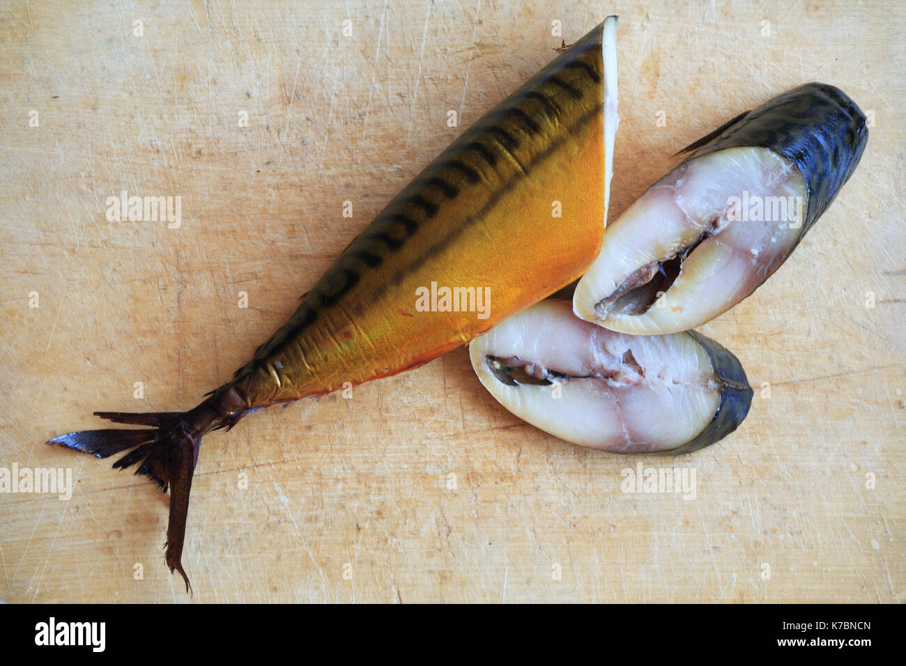 Sliced bloated fish on wooden board Stock Photo