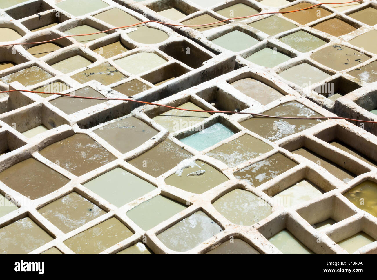 Closeup of white vats at a tannery in Morocco, Africa. Stock Photo