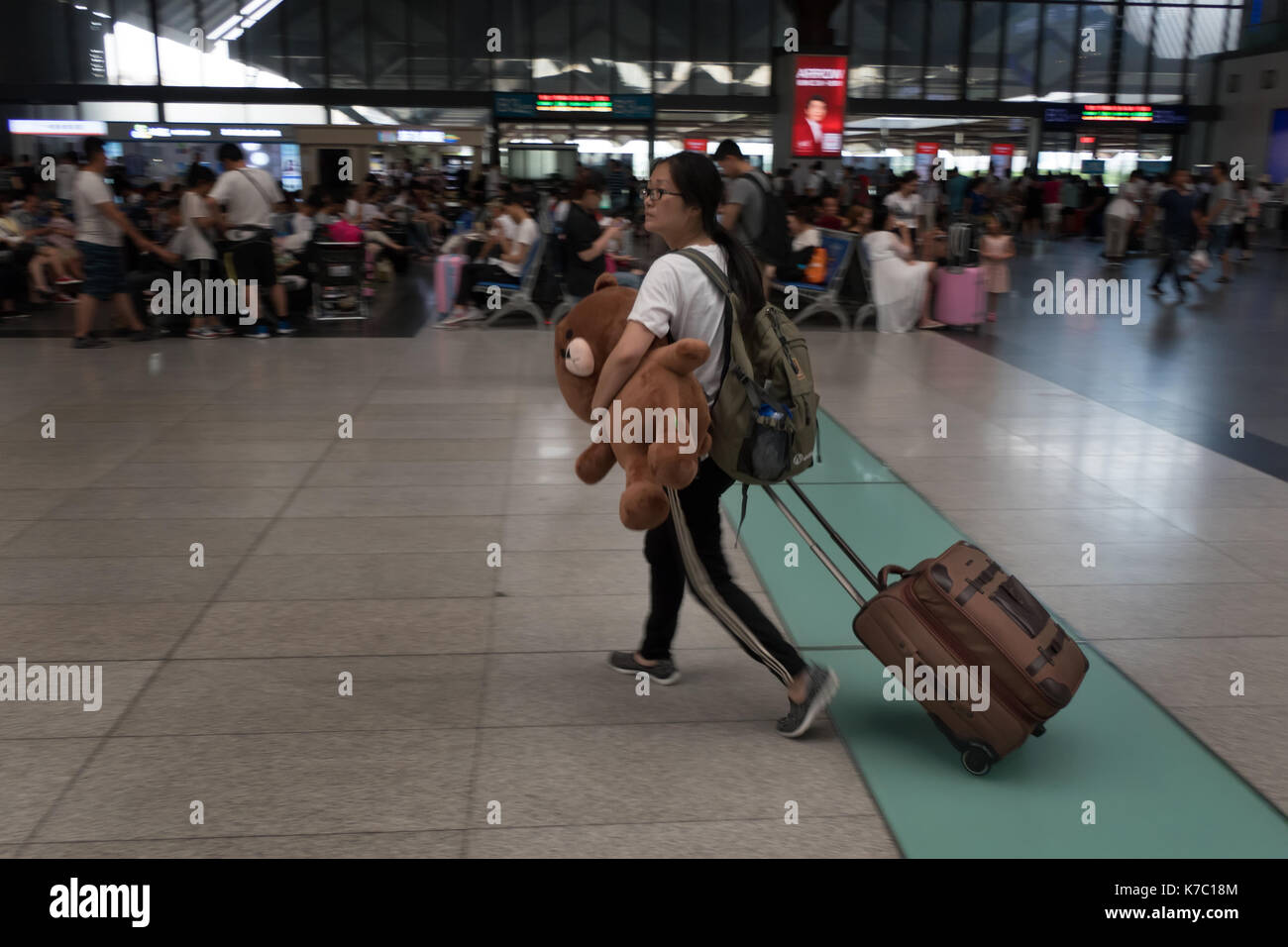 Railway station in Suzhou, China, Asia with crowd, Chinese people and Asian commuters walking