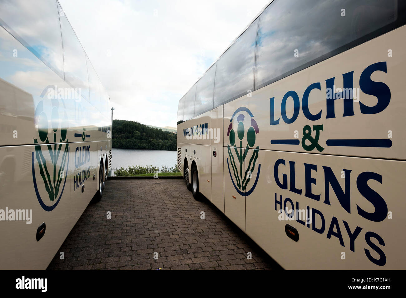 Lochs and Glens Holidays tour coaches parked at The Loch Awe Hotel above the Loch Awe railway station, Argyll, Scotland Stock Photo