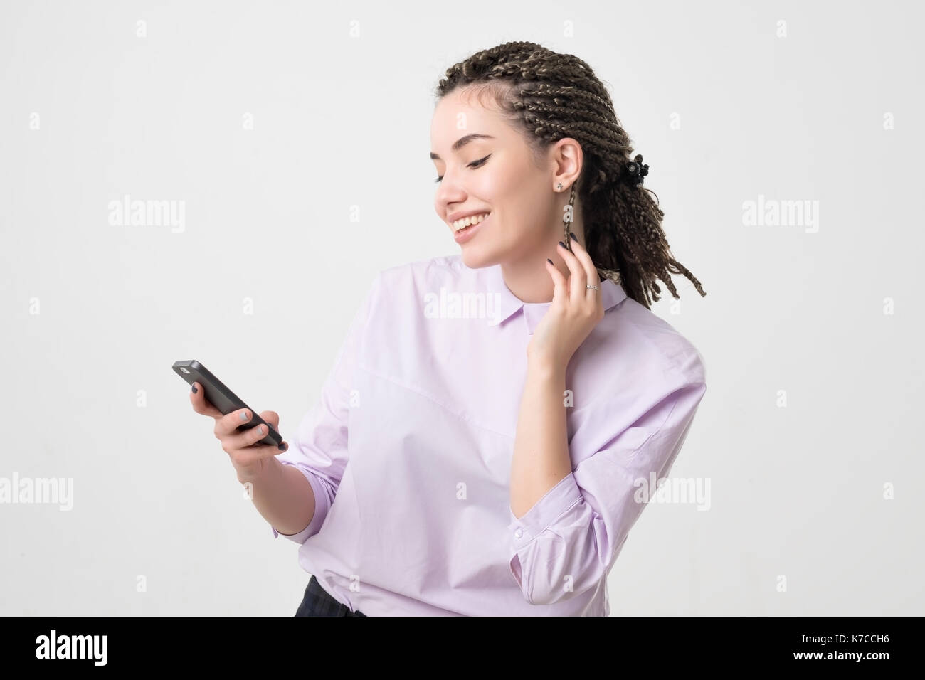 Caucasian woman spending free time using a smart phone. Stock Photo