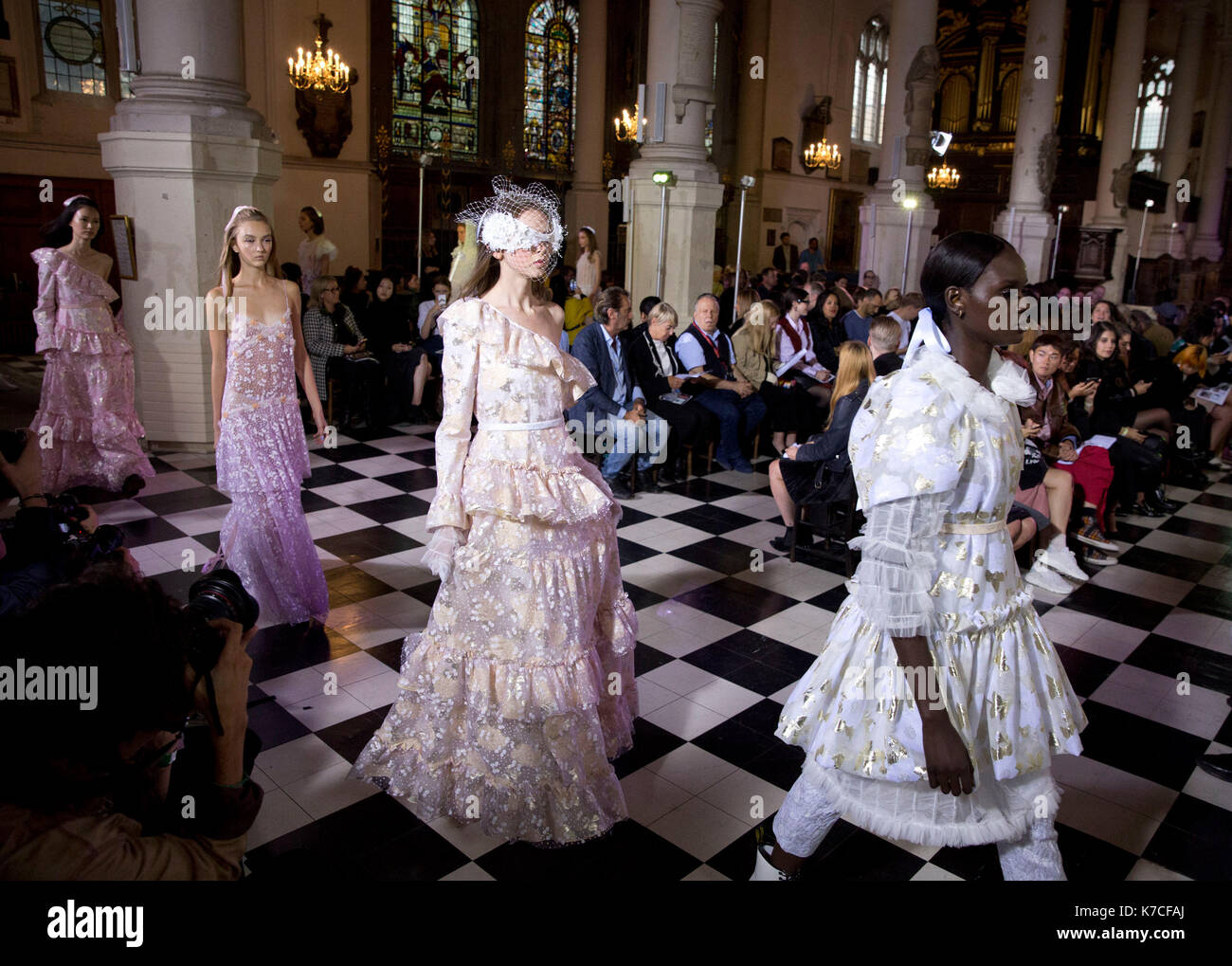 Models on the catwalk during the Ryan LO London Fashion Week SS18 show held at St Sepulchre-without-Newgate Church, London. Stock Photo