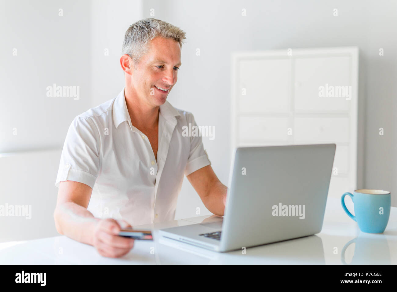 Man 40s laptop home office hi-res stock photography and images - Alamy