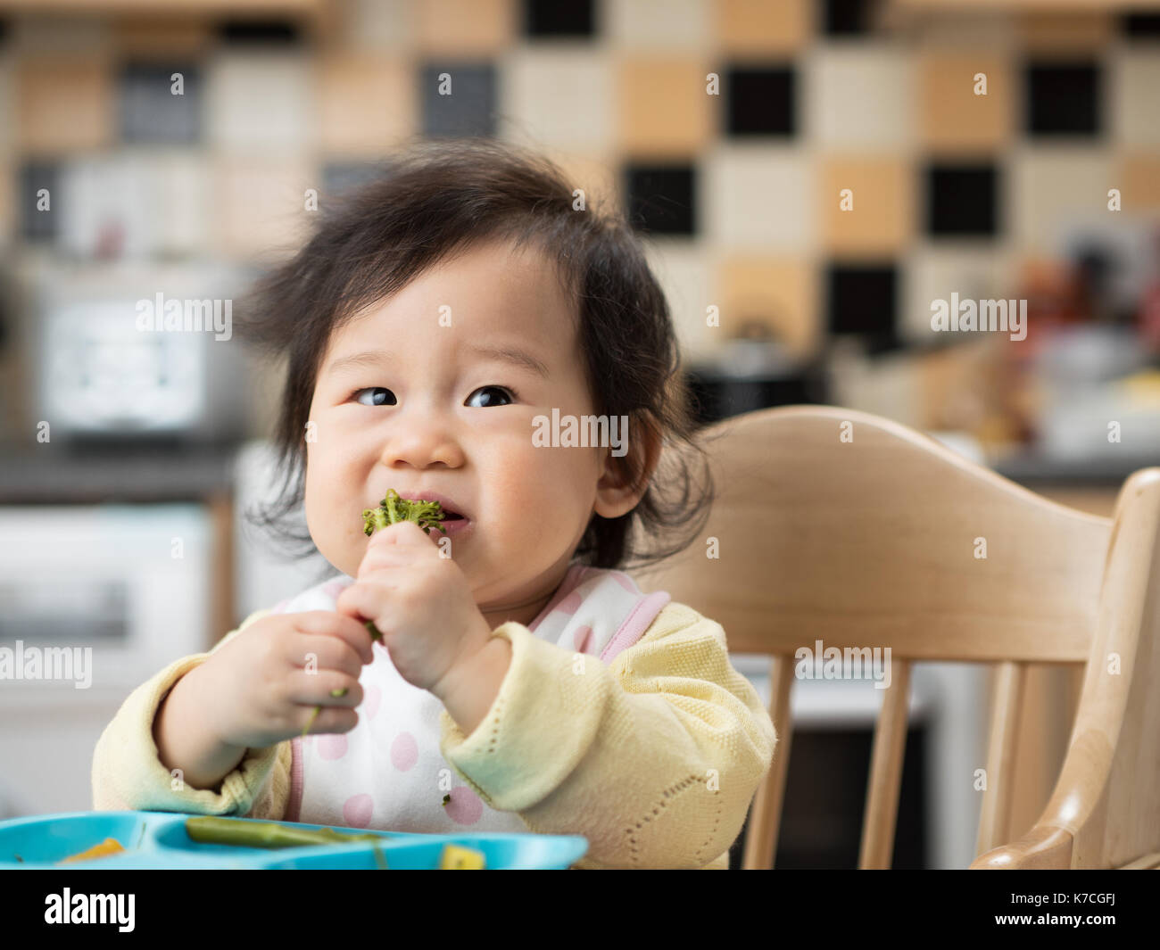 baby eating vegetable at home Stock Photo - Alamy