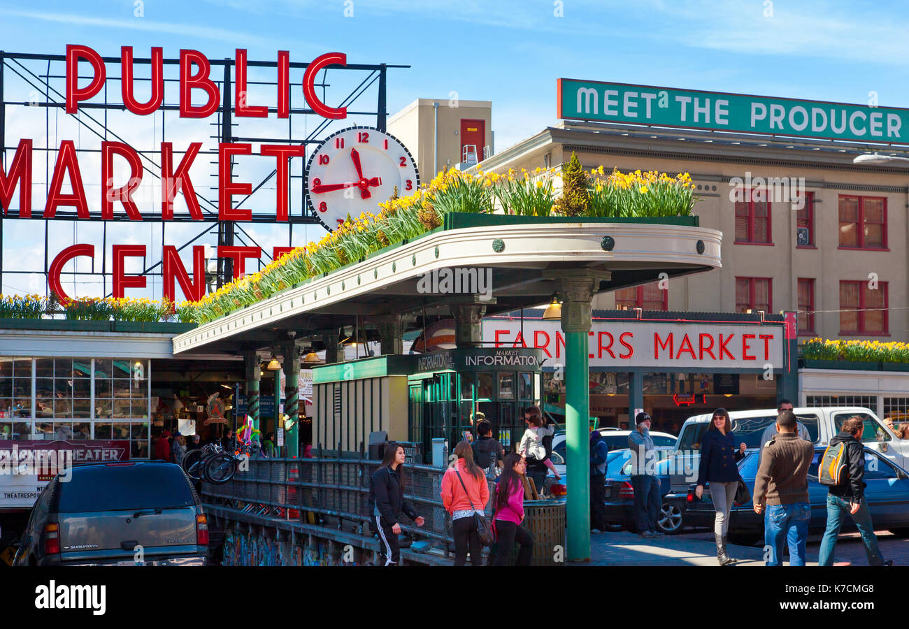 Seattle Public Market at Pike Place. View of famous iconic neon sign and crowds of shoppers Stock Photo
