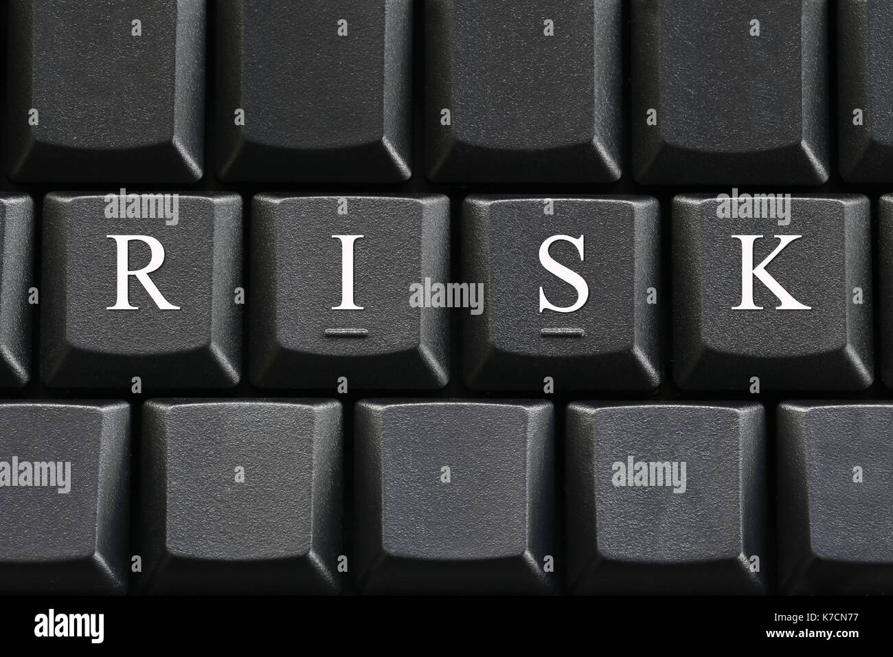 The white letter of Risk on computer keyboard background for design in ...
