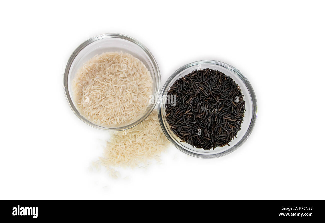 Basmati and wild rice in clear glass bowls from above Stock Photo