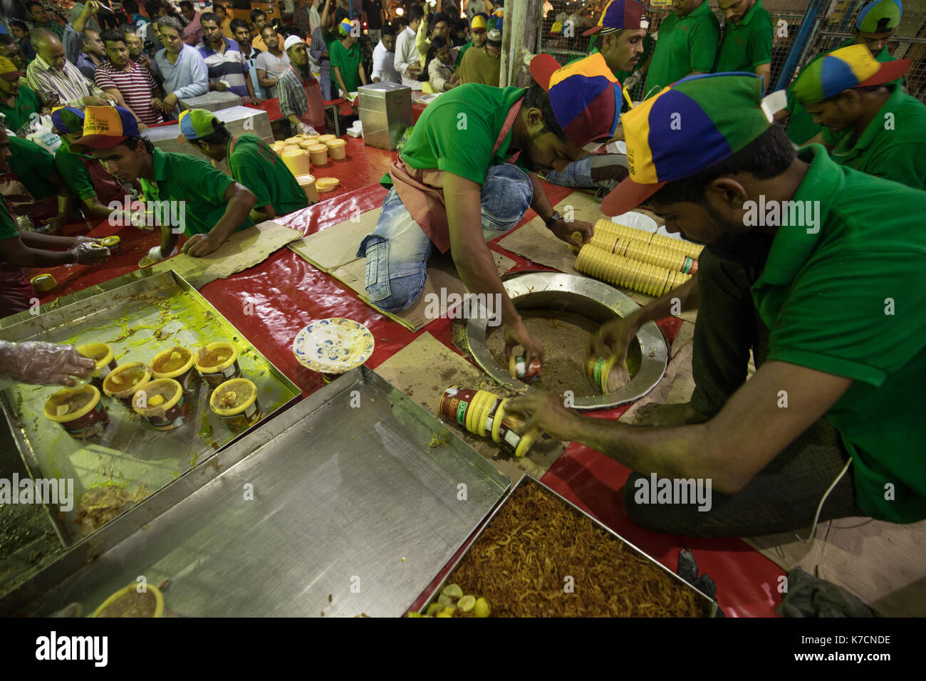 Staff packing Haleem in plastic containers for sale in Hyderabad,India
