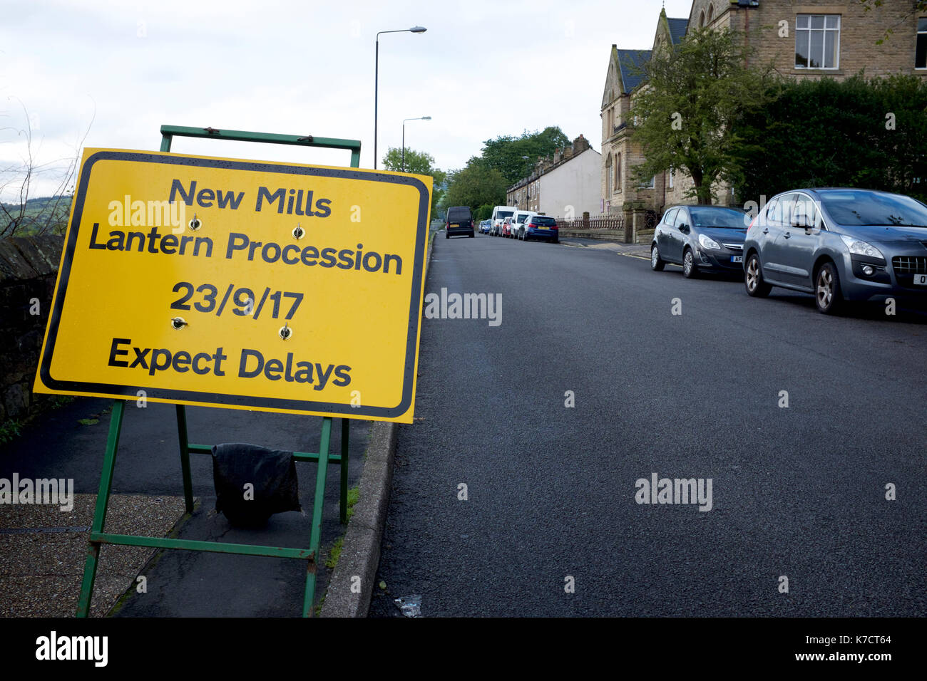 A road notice indicating future delays in New Mills. Stock Photo