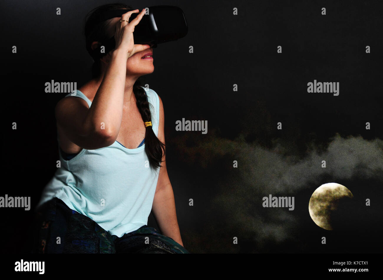 Woman using VR headset - concept image Stock Photo