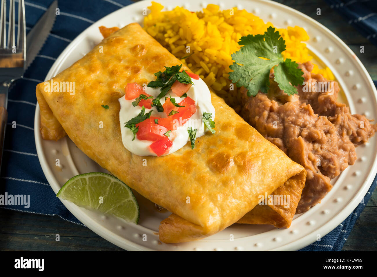 Deep Fried Beef Chimichanga Burrito with Rice and Beans Stock Photo