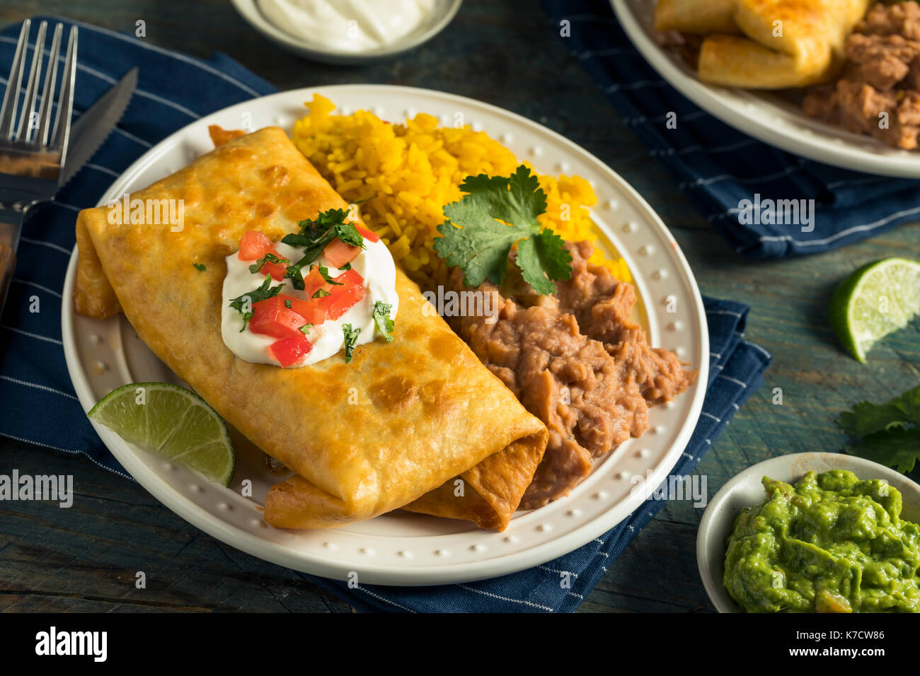 Deep Fried Beef Chimichanga Burrito with Rice and Beans Stock Photo