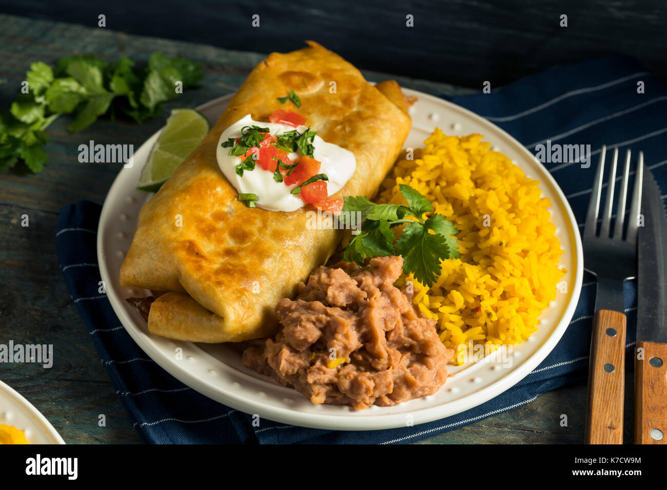 Deep Fried Beef Chimichanga Burrito with Rice and Beans Stock Photo