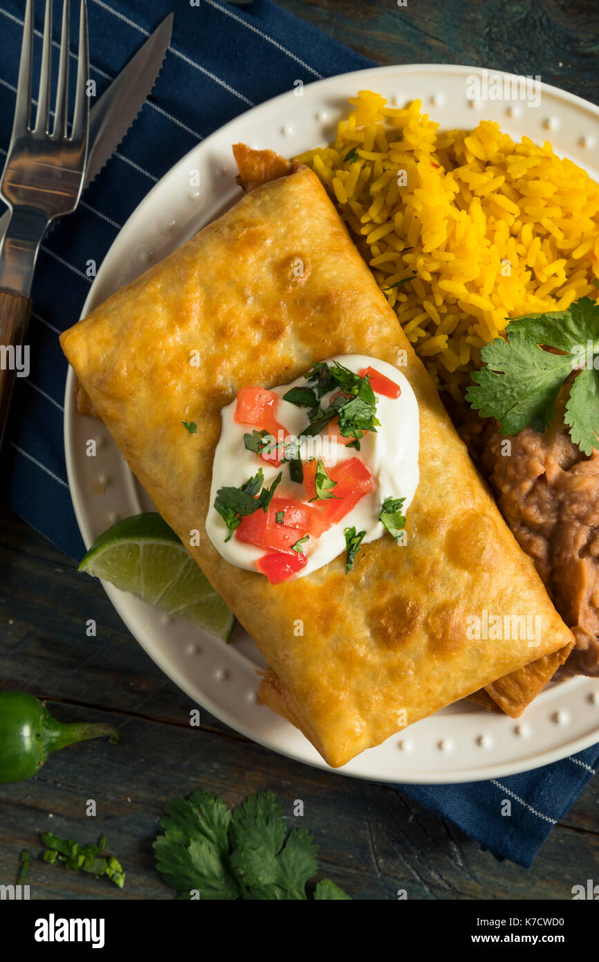 Deep Fried Beef Chimichanga Burrito with Rice and Beans Stock Photo