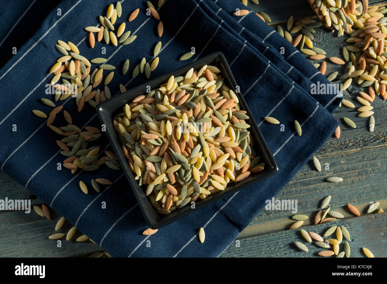 Dry Organic Tricolor Orzo Pasta in a Bowl Stock Photo Alamy