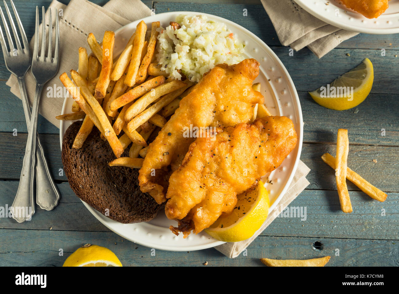 Homemade Beer Battered Fish Fry with Coleslaw and Chips Stock Photo