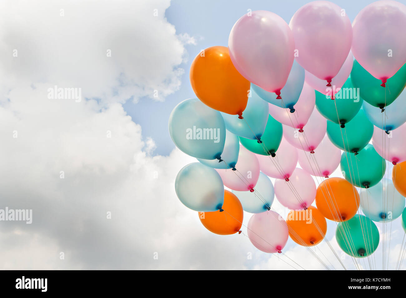 Colorful balloon on blue sky and clouds Stock Photo - Alamy