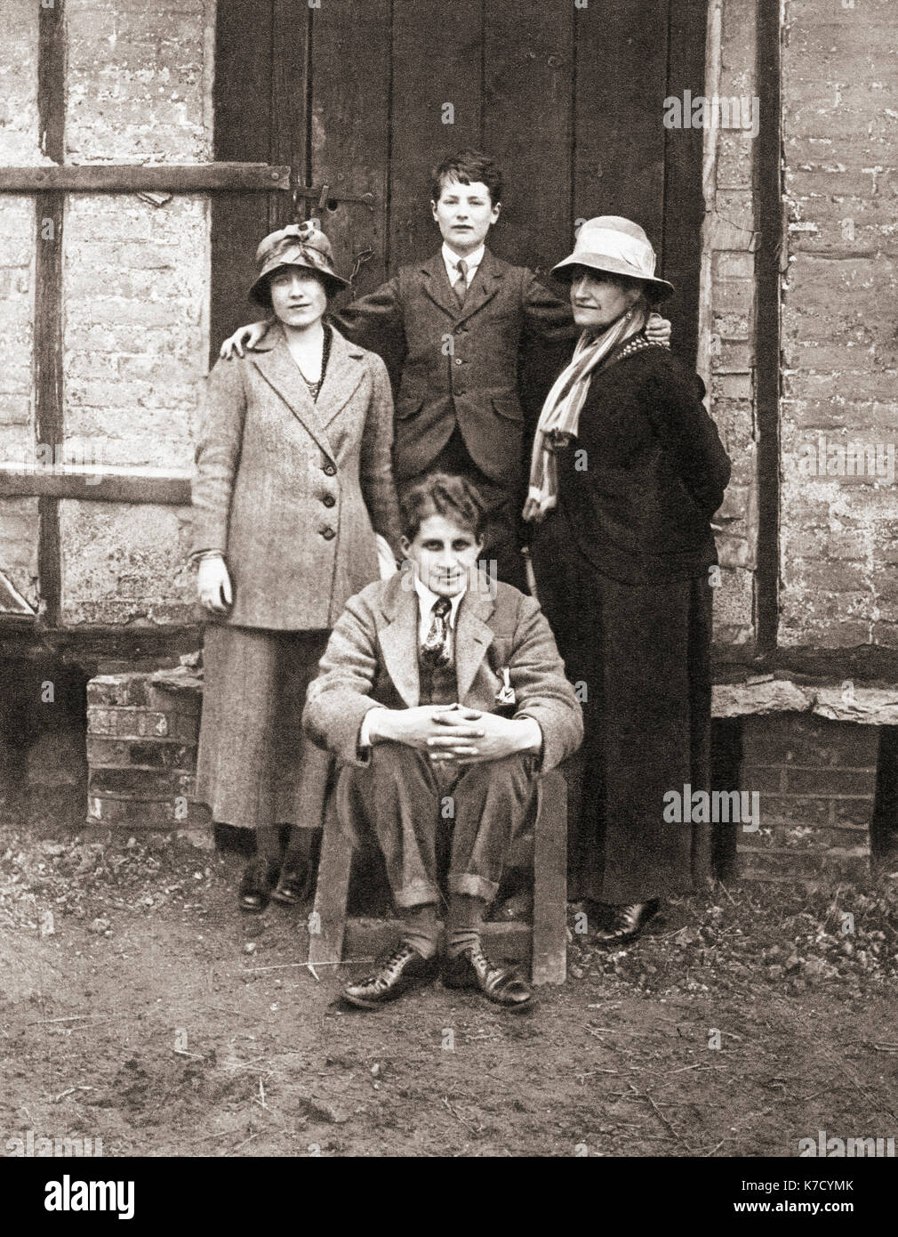 The Duchess of York, left, her mother, Cecilia Nina Bowes-Lyon, right, her brother, David Bowes-Lyon, seated and Prince Paul of Yugoslavia, seen here in 1920.  Elizabeth Angela Marguerite Bowes-Lyon, 1900 – 2002.  Future wife of King George VI and mother of Queen Elizabeth II. Cecilia Nina Bowes-Lyon, Countess of Strathmore and Kinghorne, 1862 – 1938.  Sir David Bowes-Lyon, 1902 – 1961.  Prince Paul of Yugoslavia, aka Paul Karađorđević, 1893 – 1976.  From The Coronation Book of King George VI and Queen Elizabeth, published 1937. Stock Photo