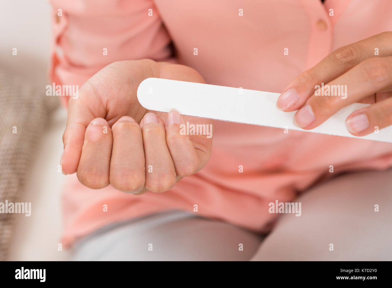 Close-up Photo Of Woman Hands Filing Nails Stock Photo