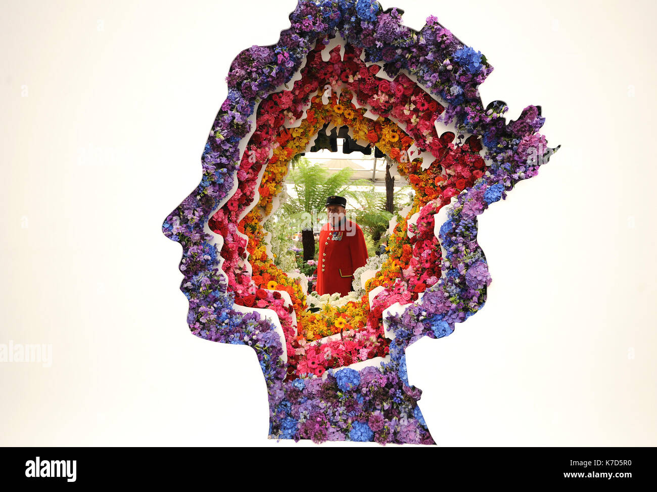 Photo Must Be Credited ©Alpha Press 079965 23/05/2016 A spectacular floral portrait of Queen Elizabeth II celebrating her 90th birthday year. The three metre high, two and a half tonne tribute in the shape of the Queen's head features 10,000 colourful flowers. The eye-catching exhibit by designer Ming Veevers Carter marks the debut of New Covent Garden Flower Market at the RHS Chelsea Flower Show 2016 held at the Royal Hospital in Chelsea, London. Stock Photo