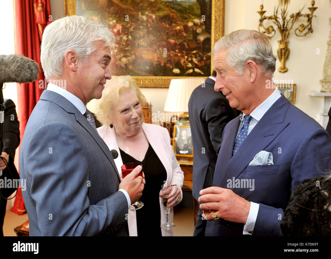 Photo Must Be Credited ©Alpha Press 073074 18/09/12 Prince Charles The Prince of Wales talks to TV presenter Phillip Schofield and Denise Robertson during a reception for celebrities and volunteers of the Diamond Champions volunteers organised by the Women's Royal Voluntary Service (WRVS), at Clarence House in central London Stock Photo