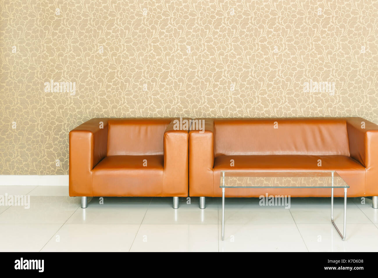 Modern Retro Brown Leather Sofa With Luxury Golden Background Stock