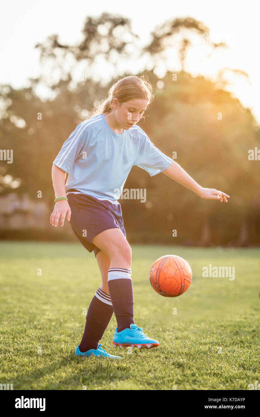 Girl kicking ball hires stock photography and images Alamy