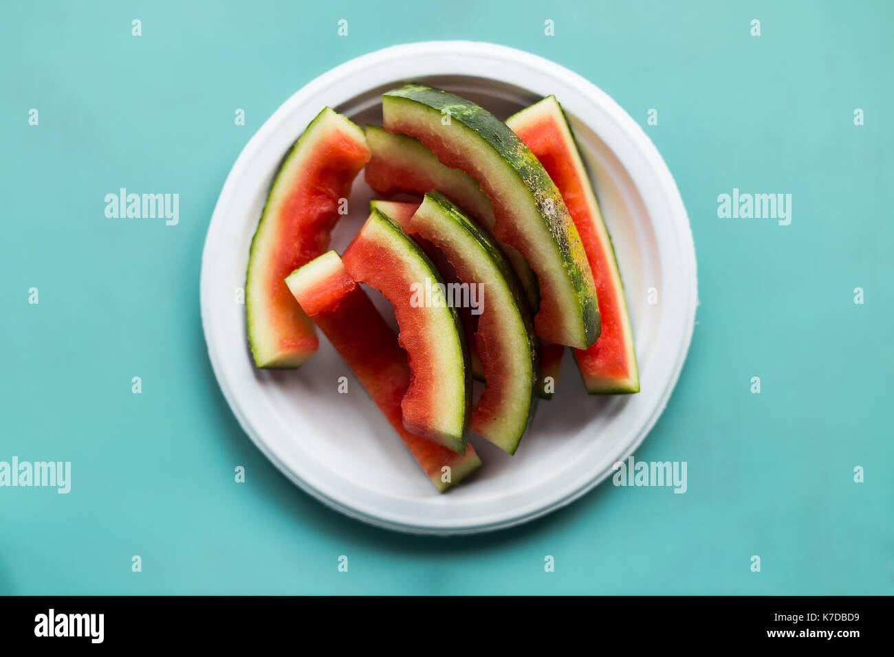 Overhead view of eaten watermelon slices in plate on table Stock Photo