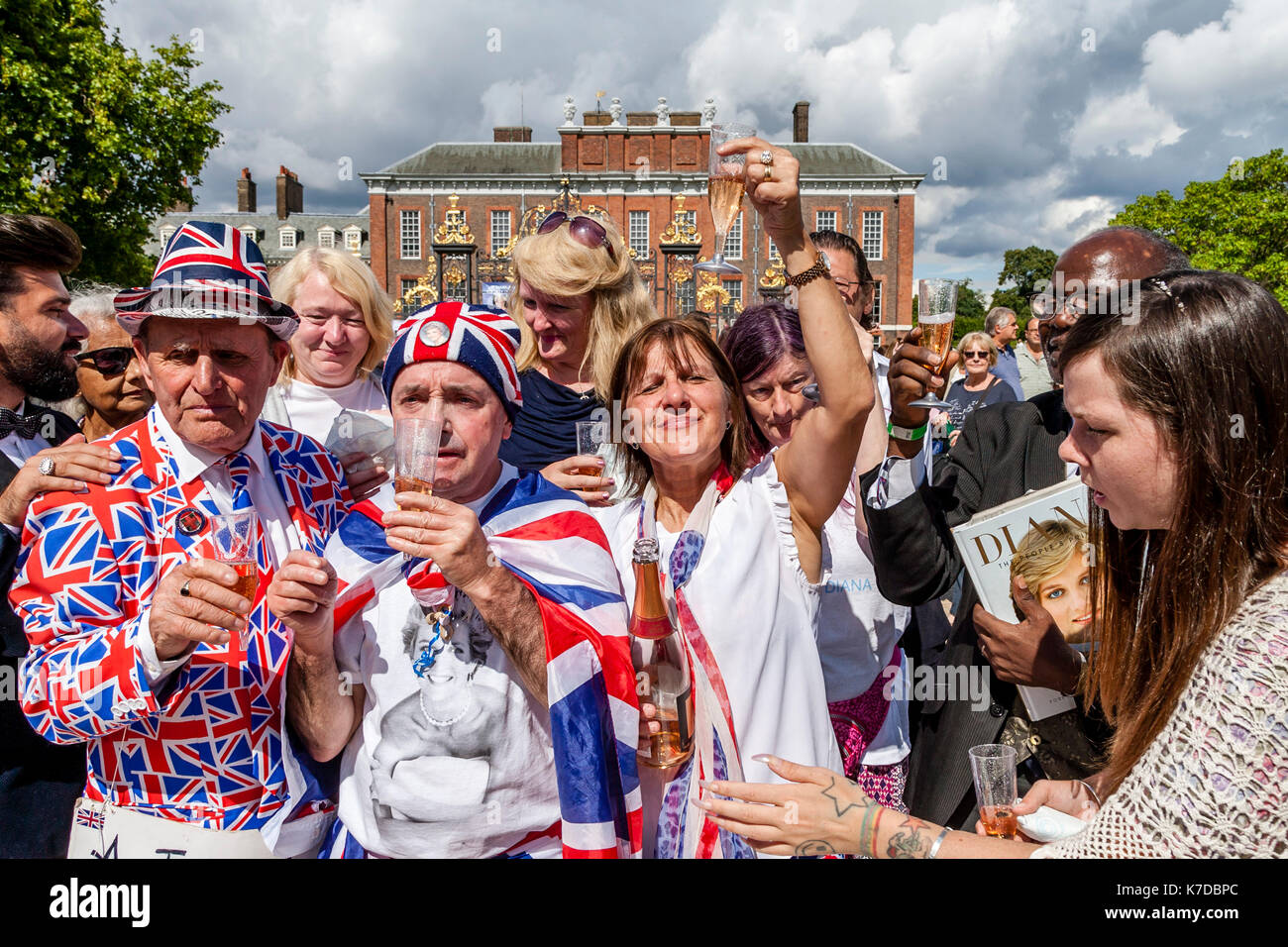 Supporters Of The Late Princess Diana Toast Her Memory With Glasses Of Champagne On The 20th Anniversary Of Her Death, Kensington Palace, London, UK Stock Photo