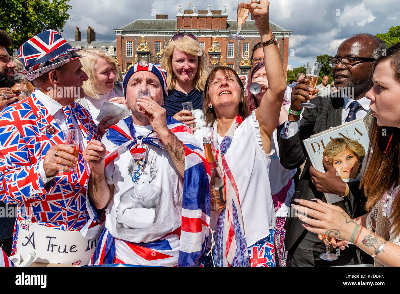 Supporters Of The Late Princess Diana Toast Her Memory With Glasses Of Champagne On The 20th Anniversary Of Her Death, Kensington Palace, London, UK Stock Photo