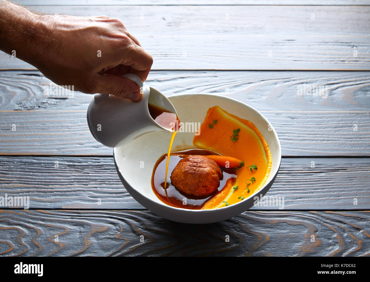 Dumpling of old cowtail with creamy carrot and its juice Stock Photo