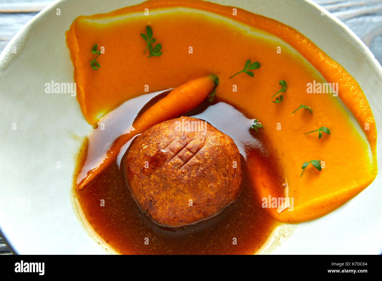 Dumpling of old cowtail with creamy carrot and its juice Stock Photo